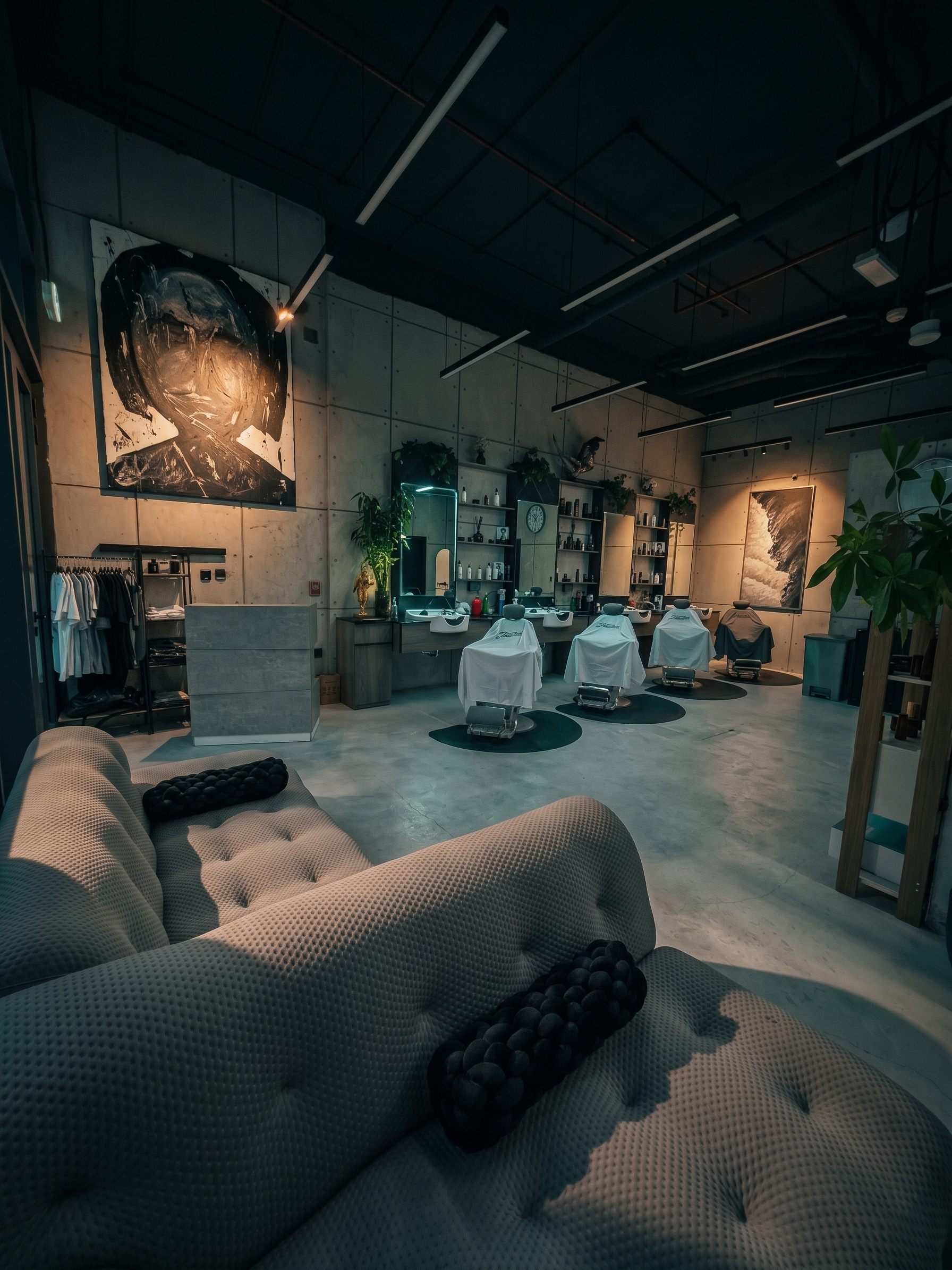The room — wide interior, chair and mirror, warm practical lighting, empty.